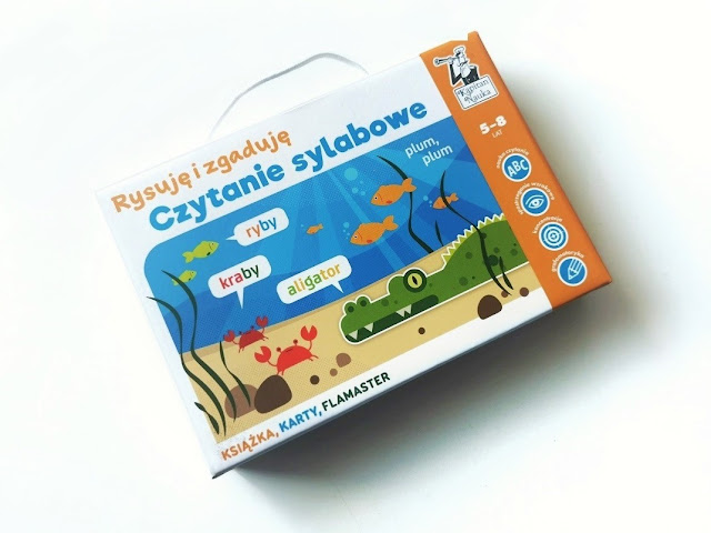 na zdjęciu pudełko z grą rysuję i zgaduję czytanie sylabowe