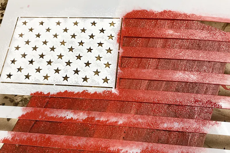 stencil of an American flag with red paint