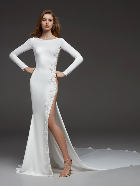 Camilla - elegance of crepe, a flattering bateau neckline, sophisticated long sleeves with a breath-taking side slit - K'Mich Weddings - wedding planning - wedding dresses - camilla - pronovias collection