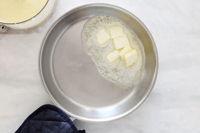 melting butter in preheated hot pan