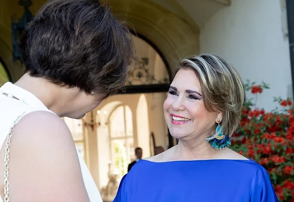 Duke Henri, Maria Teresa, Prince Guillaume and Princess Stephanie at a reception. Maria Teresa wore blue dress, Stephanie wore Prada floral dress