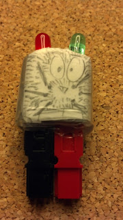fully assembled Anderson PowerPole polarity checker with a cat-face drawn on it for humor.