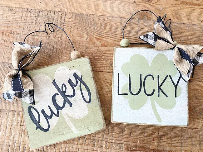 lucky signs with bows and wire hangers