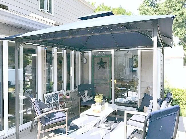 gazebo with navy blue outdoor furniture