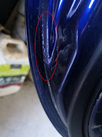 Rust patch on passenger door of Mazda Roadster