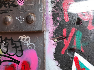 Skulferatu #41 in wall at remains of Leith Walk Railway Bridge - Skulferatu is in a gap in the wall next to an iron block with rivets in it. Photo by Kevin Nosferatu for the Skulferatu Project