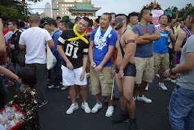 Young men being photographed at 2011 Taiwan LGBT Pride Parade 