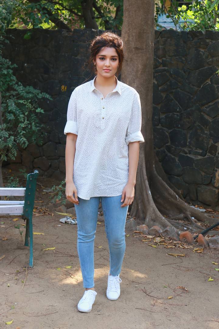 Telugu Actress Ritika Singh Stills In White Shirt Blue Jeans