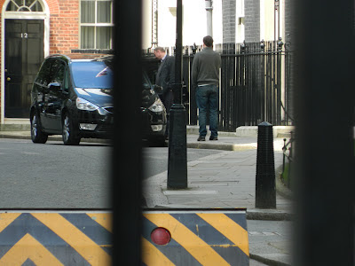 David Cameron outside Number 10, Downing Street, talking into a mobile phone - Sunday 13th April 2012