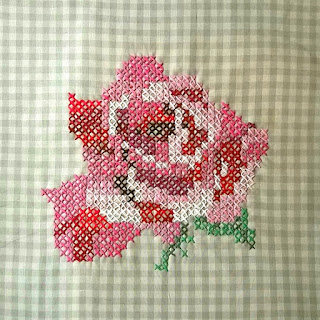 Cross-stitch rose on check gingham
