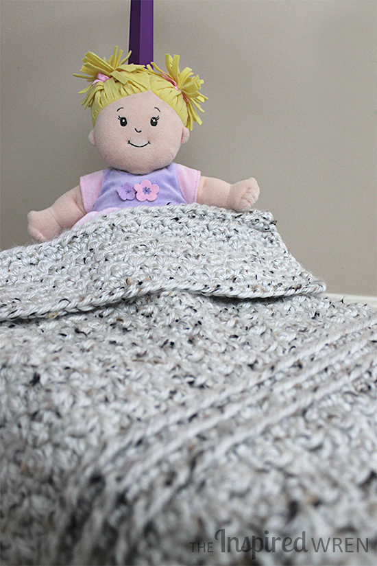 Chunky Doll Blanket: Quickly hook up a squishy doll blanket with this simple, contemporary crochet pattern worked in super bulky yarn. | The Inspired Wren