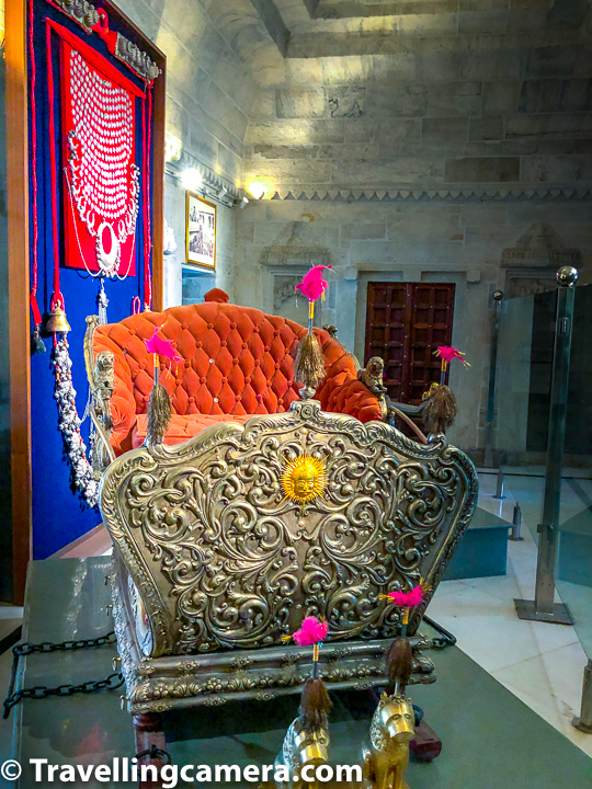 Above photograph shows silver kart which was used as Elephant-kart for the kind. Notice that sun on front part of this kart. It was believed to be an auspicious sun in Mewar. The king everyday started the day with a view of this sun. No matter if it's a cloudy morning or not, this sun sign always remained important in Udaipur City Palace. The bigger version which was used by the king is now kept on display inside the palace. This section of the Udaipur City Palace more such silver made elephant-karts.