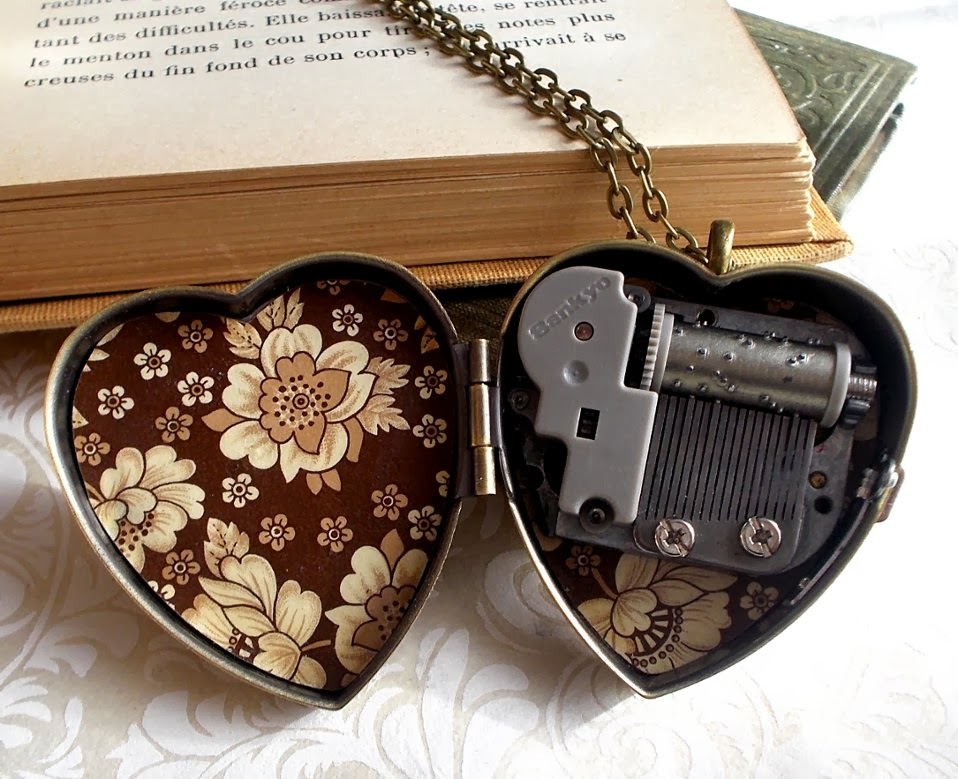 Plucked Pins, A Music Box Blog Charming cat face musical locket