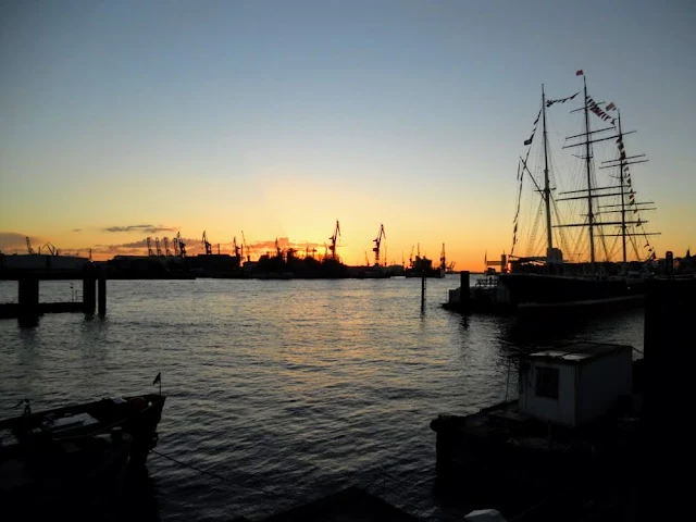 What is Hamburg famous for? Sunsets over Hamburg port.