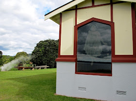 Detail of a window feature in a church, showing Jesus dressed in a maori cloak.