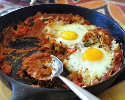 Refried Bean Sauce with Eggs on Top ♥ KitchenParade.com, a hearty protein-packed weekend brunch recipe.