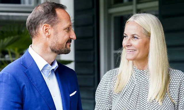 Crown Princess Mette-Marit wore a high neck belted polka-dot silk midi dress by Diane von Furstenberg. Malone Souliers Brenda stripe pumps