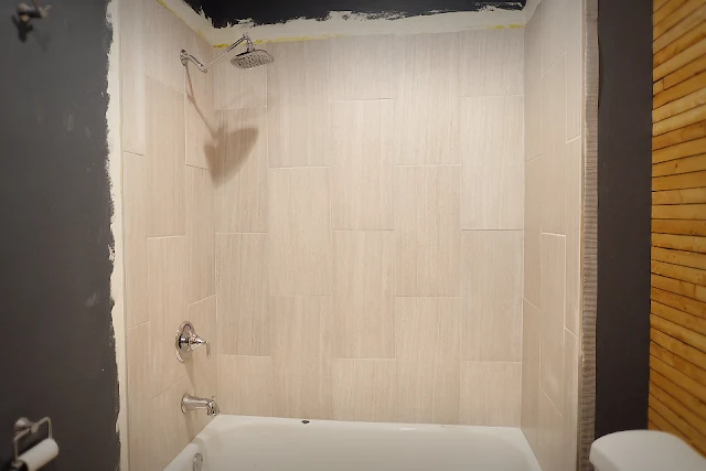 shower tile large format 12x24 surround tub after