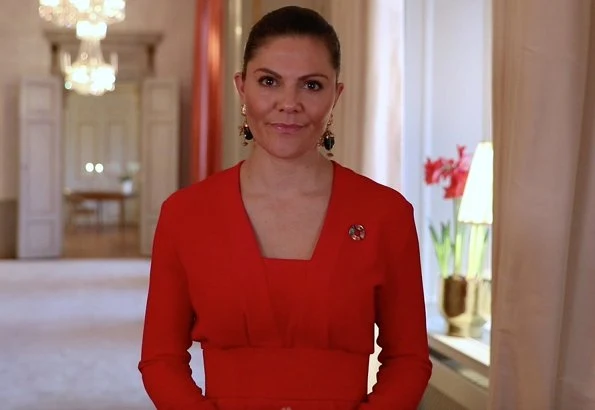 Crown Princess Victoria wore multifunctional earrings from H&M Conscious Collection, and a red dress from H&M Conscious Collection