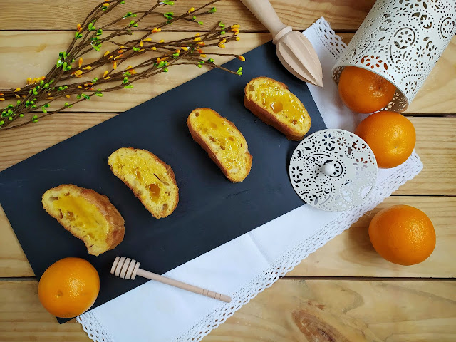 Torrijas de naranja. Receta de Cuaresma y Semana Santa. Postres tradicionales. Almíbar. Miel. Repostería de sartén. Cuca