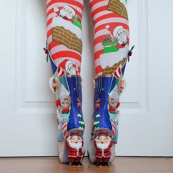 back view of legs in Christmas tights with Santa heeled glitter boots