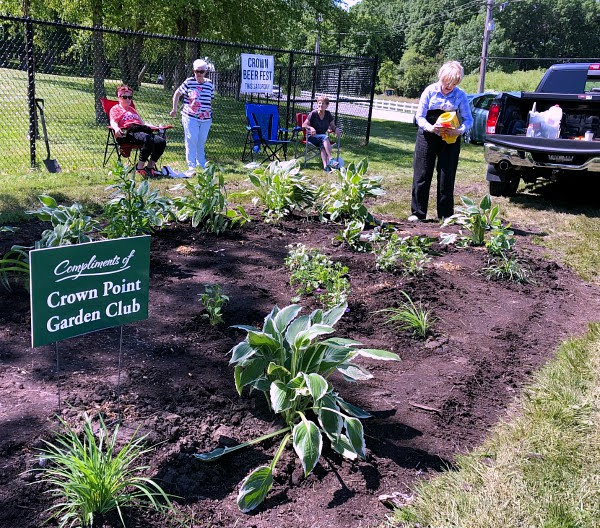 Crown Point Garden Club planting up a beautiful pollinator garden