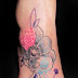 NEAT DESING FLOWER TATTOO ON FOOT