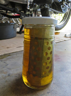 New oil filter gets a dunk in clean oil.
