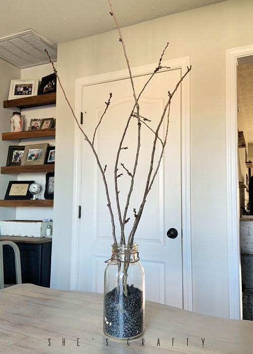 Halloween table centerpiece - branches in a jar with black beans