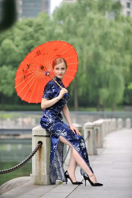 Cheongsam is a tight-fitting full-length dress with a high cooler and curved crossed opening in front and a cut at the side