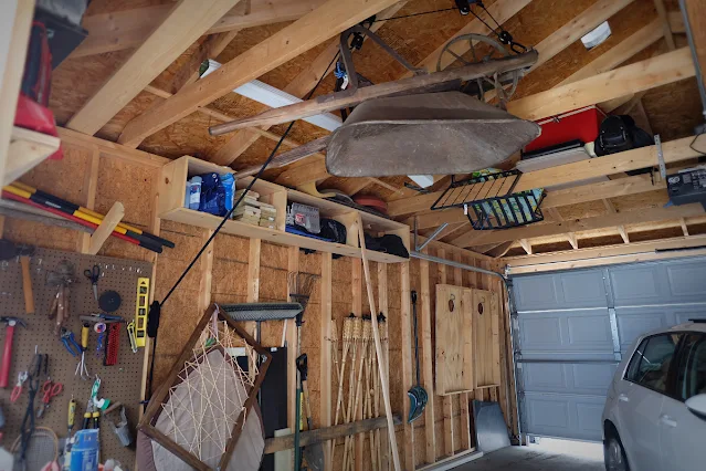 garage storage for wheelbarrow hanging from ceiling