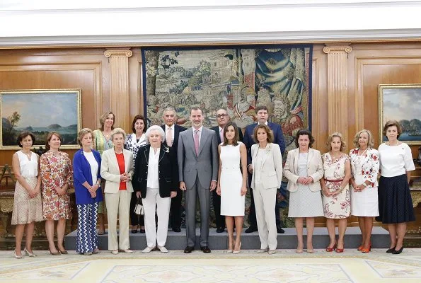 Queen Letizia wore Prada pumps, Tous pearl earrings. Princess Pilar de Borbon Nuevo Futuro Association (New Future)