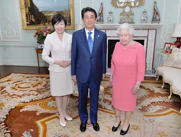 Queen Elizabeth of Great Britain hosts a private audience with Japanese Prime Minister Shinzo Abe, and his wife Akie at Buckingham Palace