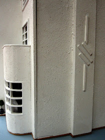 Side view of an Art Deco moderne-style dolls house by Anne Reid