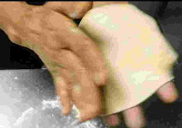 Flatten dough ball by the palm of both hands for tandoori roti recipe