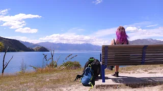 woman on bench looking at sea view needing energy to get up