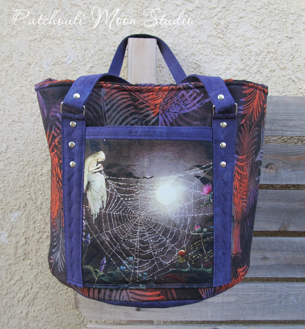 Patchouli Moon Studio~ Round Tote Bag with Drawstring Top, Handles & Pockets View close up of the front of the bag and closer look at the pocket
