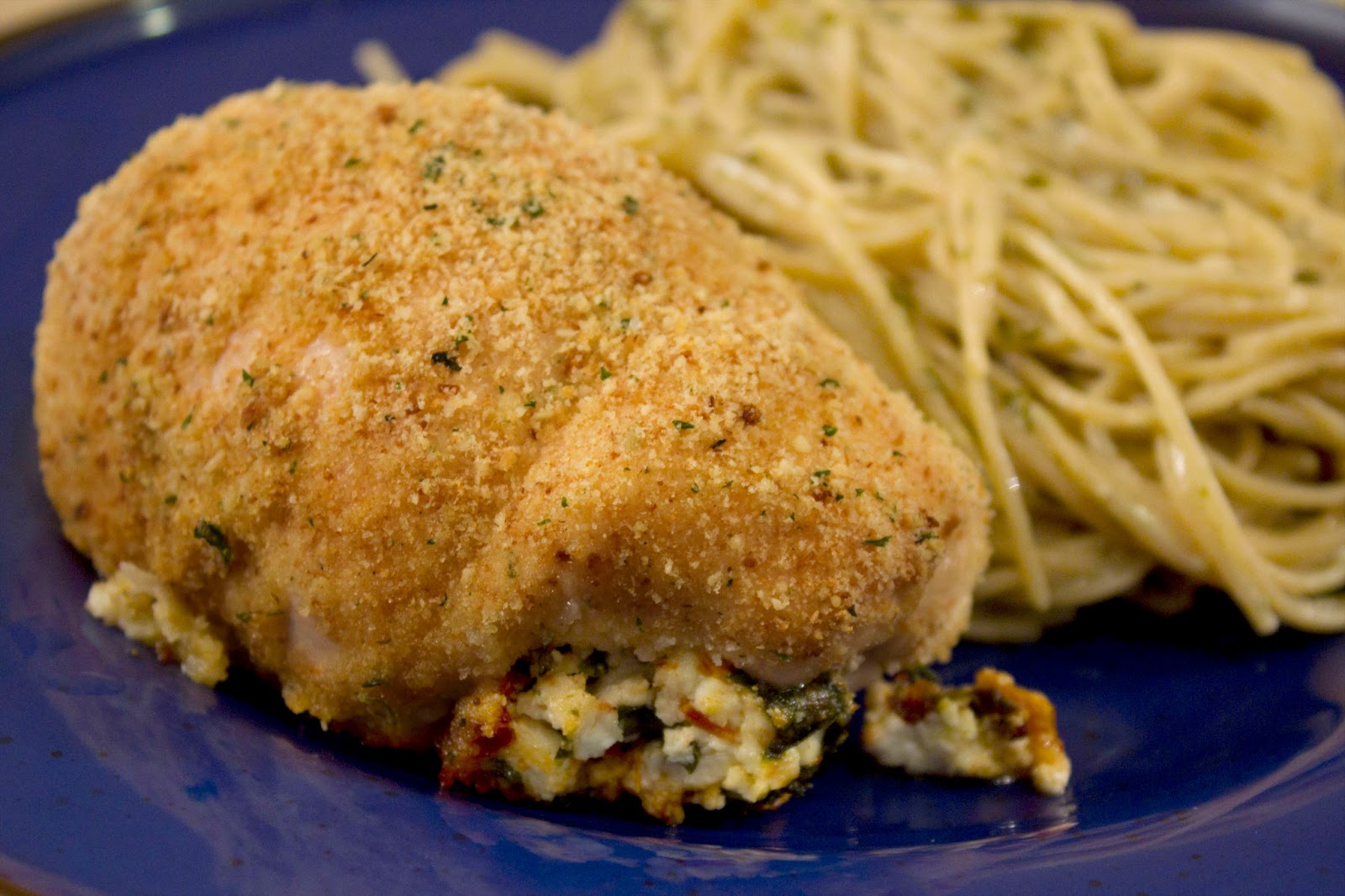 Munched Spinach, Sun Dried Tomato and Goat Cheese Stuffed Chicken