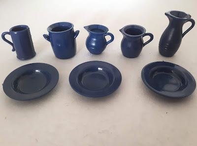 Miniautre set of blue crockery, including jugs, a crock, a stein and three plates,