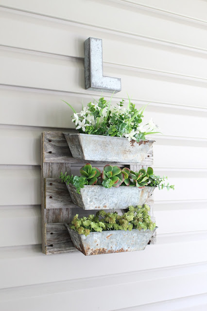 a finished DIY pallet board project using turpentine boxes and salvaged pallet pieces