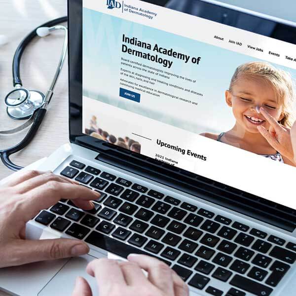 Dermatologist using the new IAD membership website