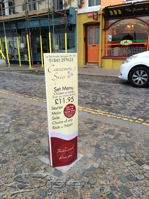 Cream, red and pink Cinnamon spice bollard sign with geometric Moroccan pattern used in the background as a design element. Wonderful for advertising to passing foot traffic to advertise your business.