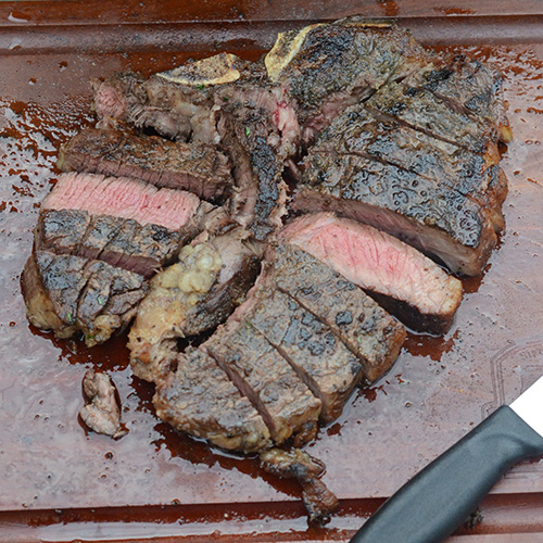 Green and Black Porterhouse on the Big Green Egg MiniMax