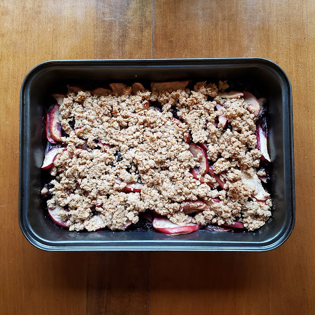 Vegan apple blueberry crumble in a medium-sized baking pan on a table