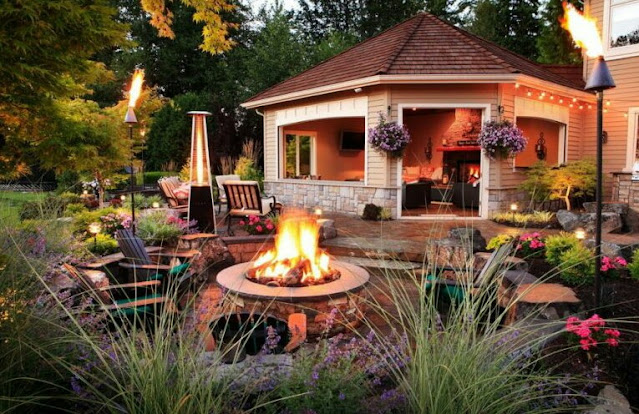 covered outdoor living spaces with fireplace