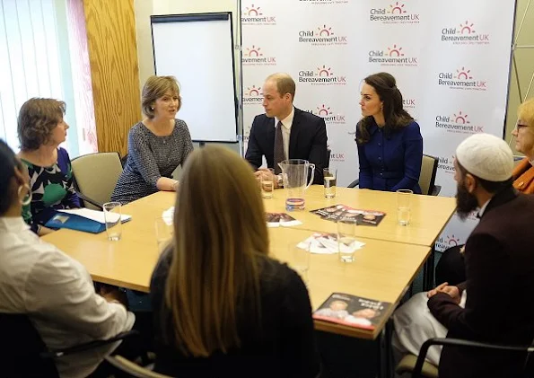 Kate Middleton wore Eponine London Belted Coat, Russell and Bromley Clutch, Gianvito Rossi Suade pumps