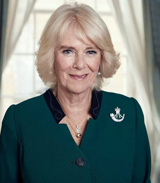 The Duchess of Cornwall took over the role of Colonel-in-Chief of The Rifles from her father-in-law, The Duke of Edinburgh. wearing a brooch