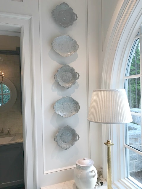 Blue plates hung on wall near sink in kitchen of 2017 Southeastern Designer Showhouse.