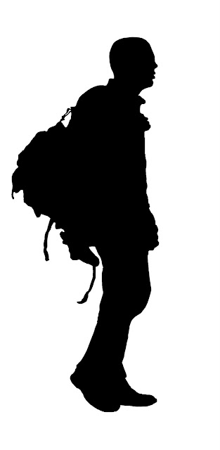silhouette of man with backpack