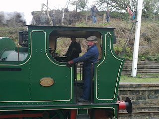 Passengers watch as No.6 heads past the southbound starting signal at Andrews House